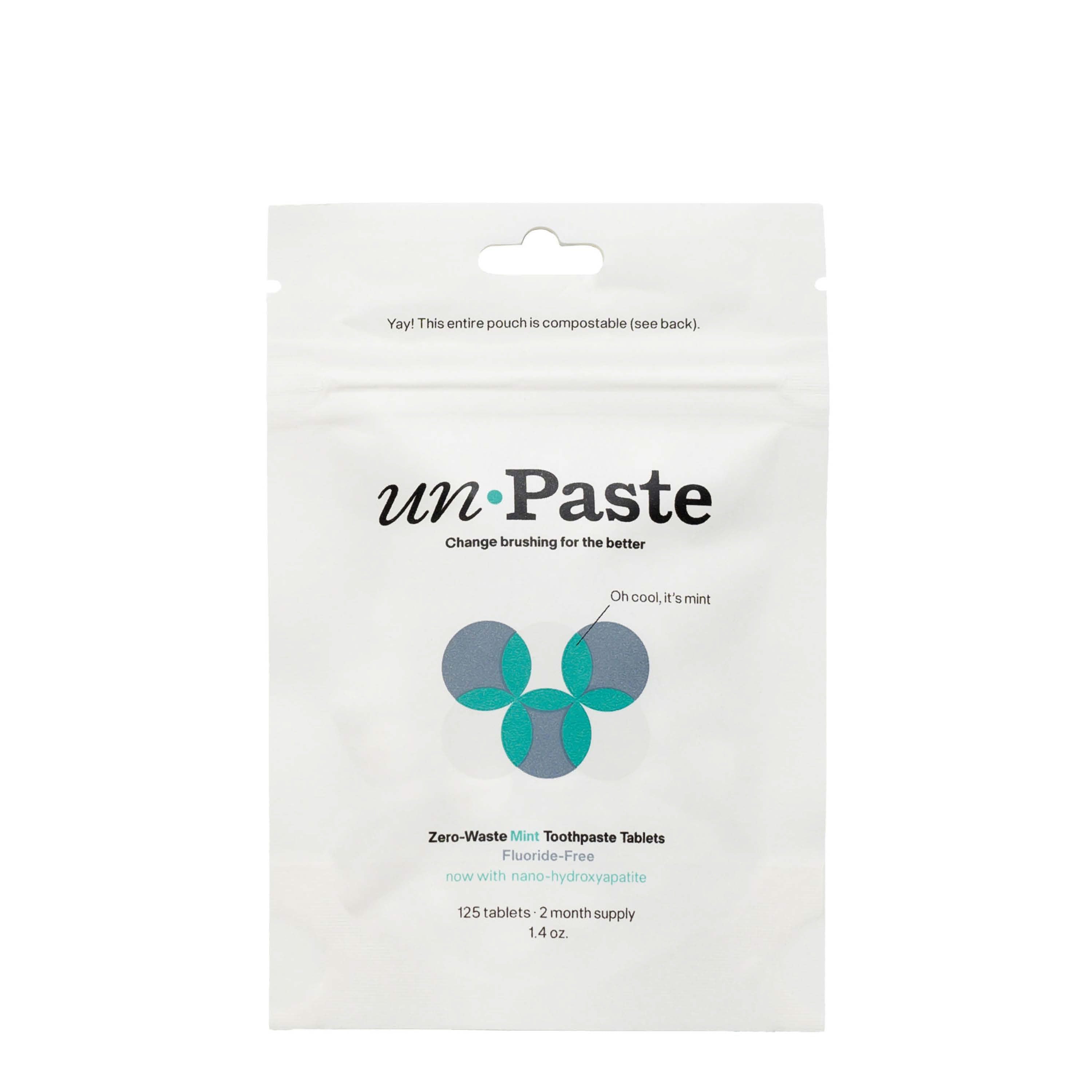 Package of unpaste zero-waste mint toothpaste tablets on a white background