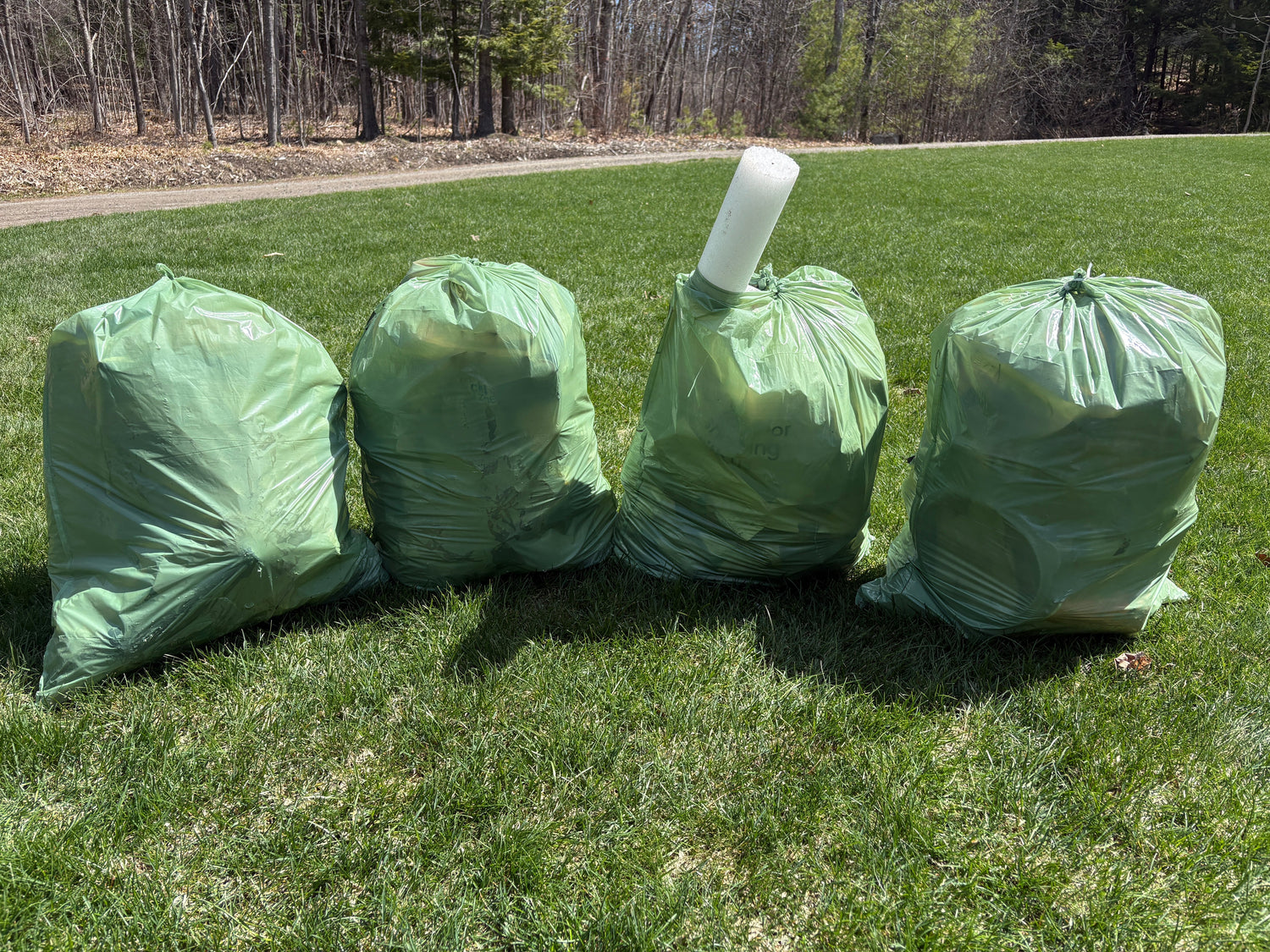 4 filled trash bags picked up by Janice