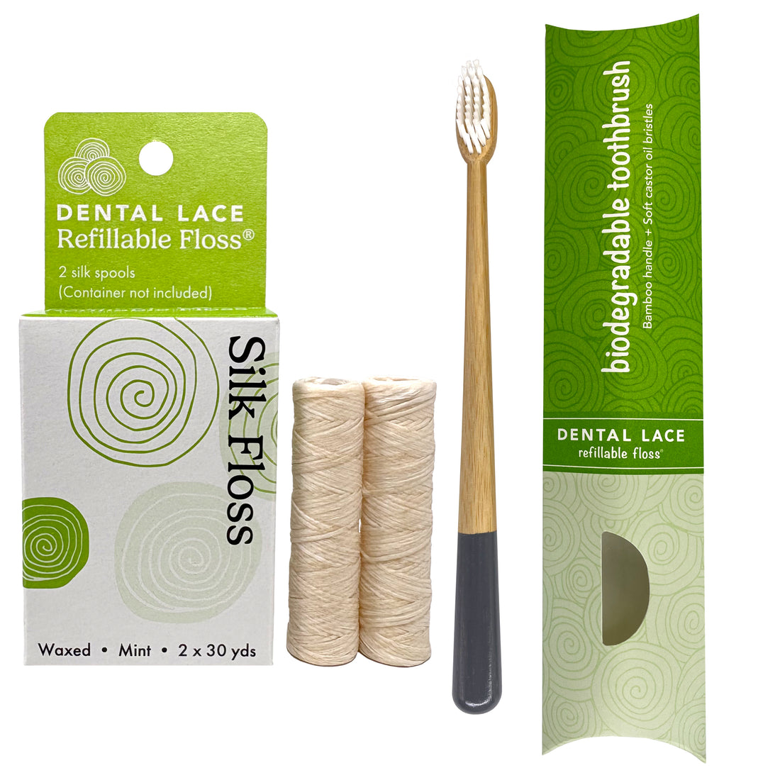 Dental Lace refillable floss packaging with two silk floss spools and a bamboo toothbrush with a grat handle in biodegradable (paper) packaging. 