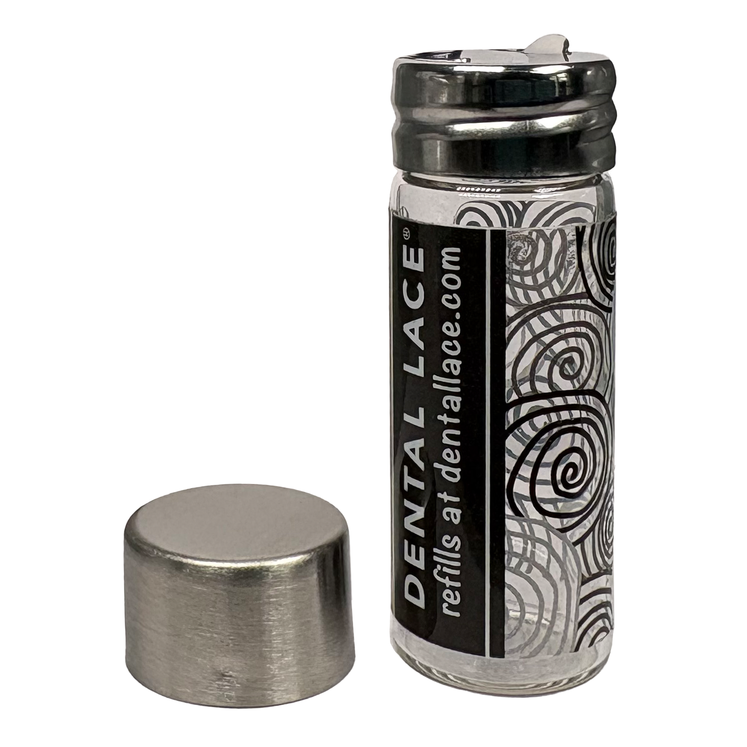 Cylindrical glass floss container with a metallic cap and black ‘Dental Lace’ label on a white background.