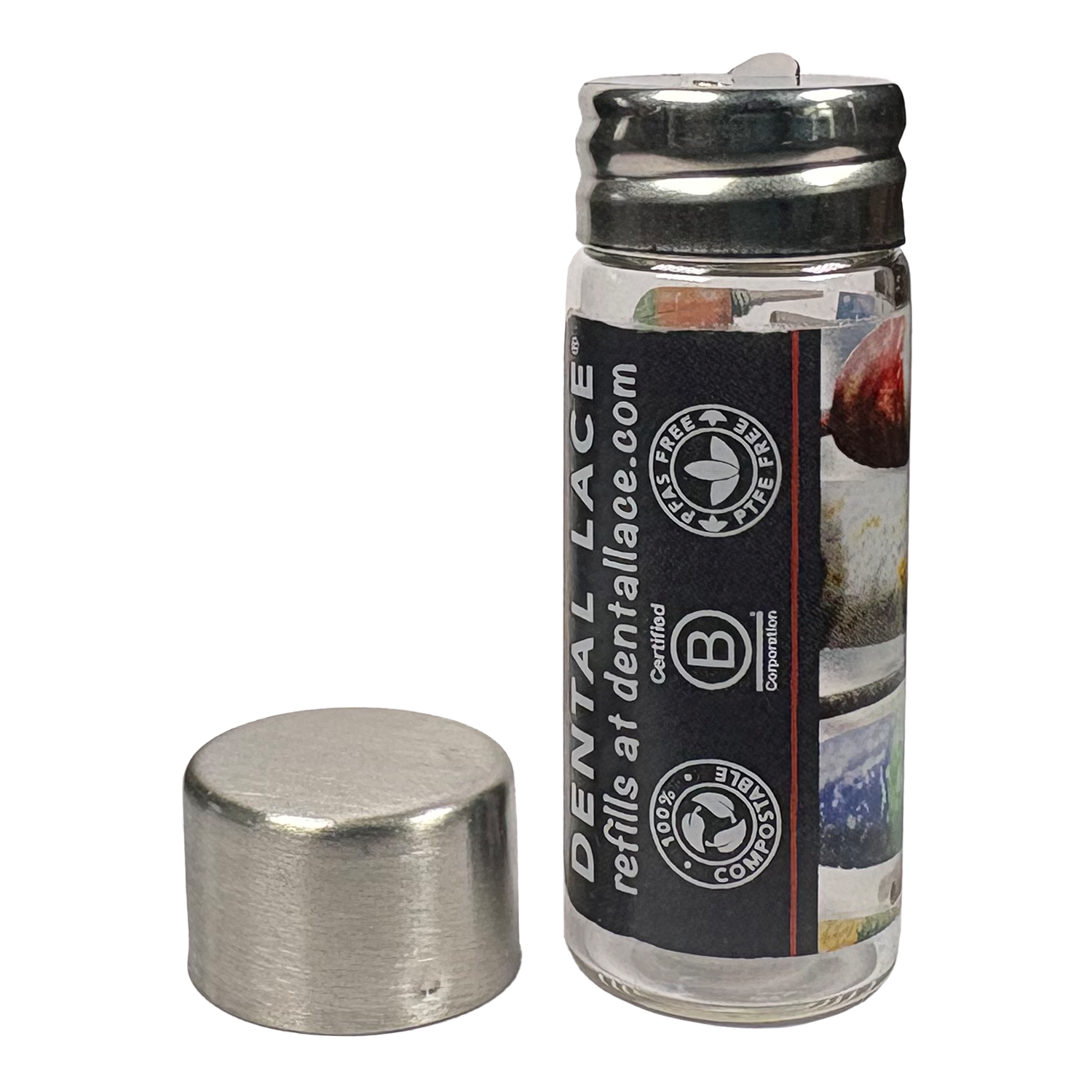Cylindrical glass floss container with a metallic cap and buoys ‘Dental Lace’ label on a white background.