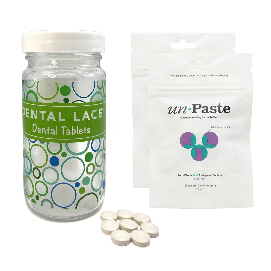 Glass Dental Lace bottle with two white Fluoride Unpaste Toothpaste Tablets packages. 