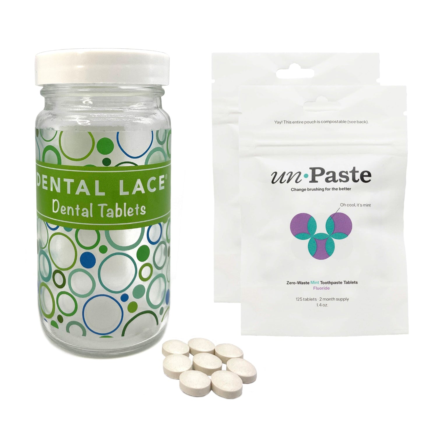 Glass Dental Lace bottle with two white Fluoride Unpaste Toothpaste Tablets packages. 