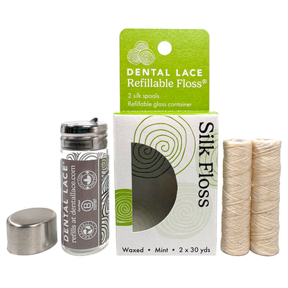 Dental Lace Gray labeled Glass Container with two silk refill spools in a white and green box. 