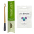 Gray toothbrush with green box and the front of a unpaste fluoride toothpaste tablets bag. 
