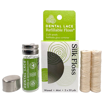 Dental Lace Green labeled Glass Container with two silk refill spools in a white and green box. 