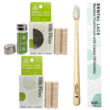 Dental care kit with a bamboo toothbrush, Silk Floss, and a refillable glass container. The toothbrush has a light natural wood handle and white bristles, shown next to its green and white packaging.
