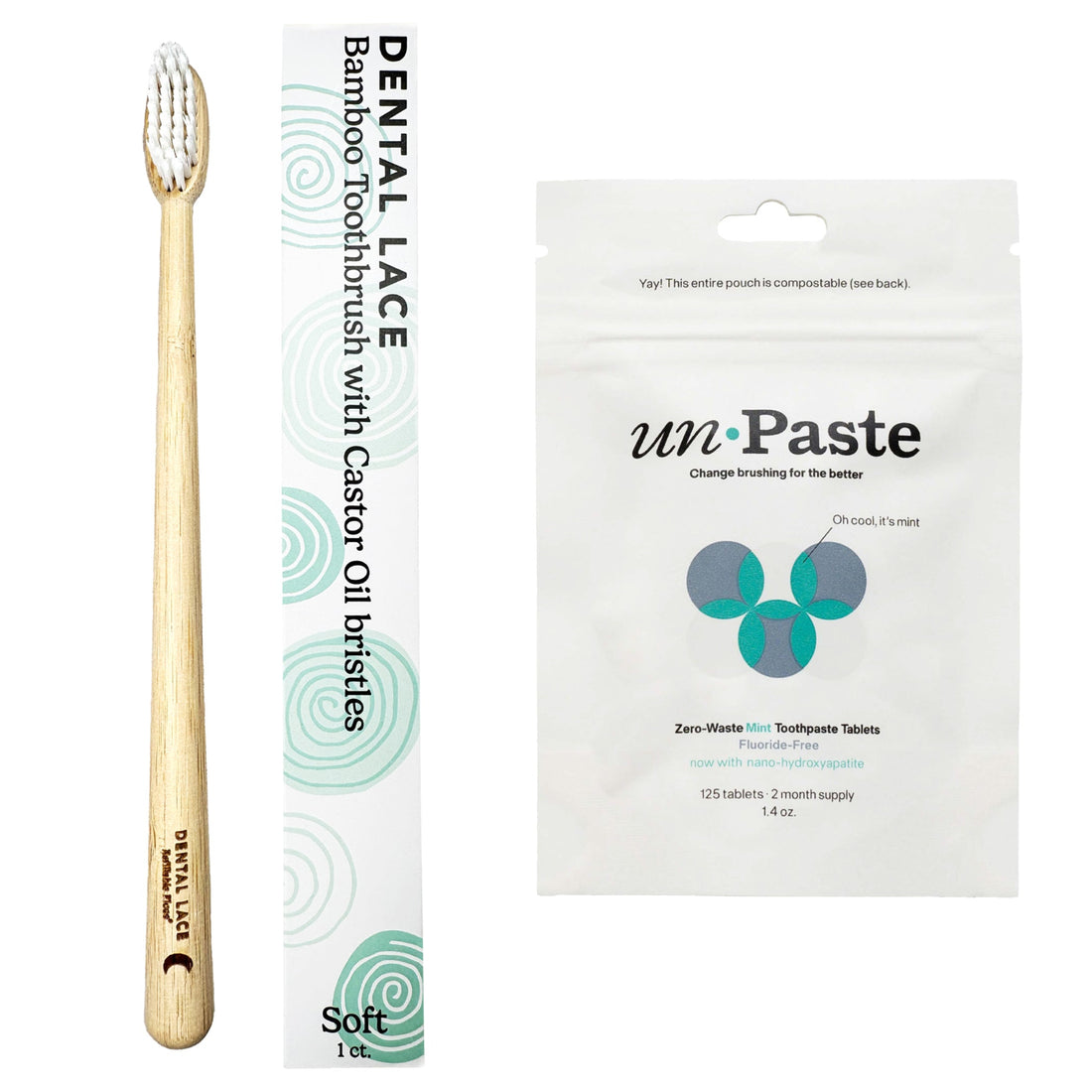 A bamboo toothbrush with a light natural wood handle and white bristles stands next to its white and mint green packaging. To the right is a white stand-up pouch of unPaste toothpaste tablets.